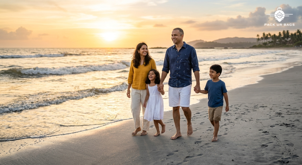 Indian family with two kids walking on a clean sandy beach at sunset, smiling, casual vacation clothing, warm golden lig