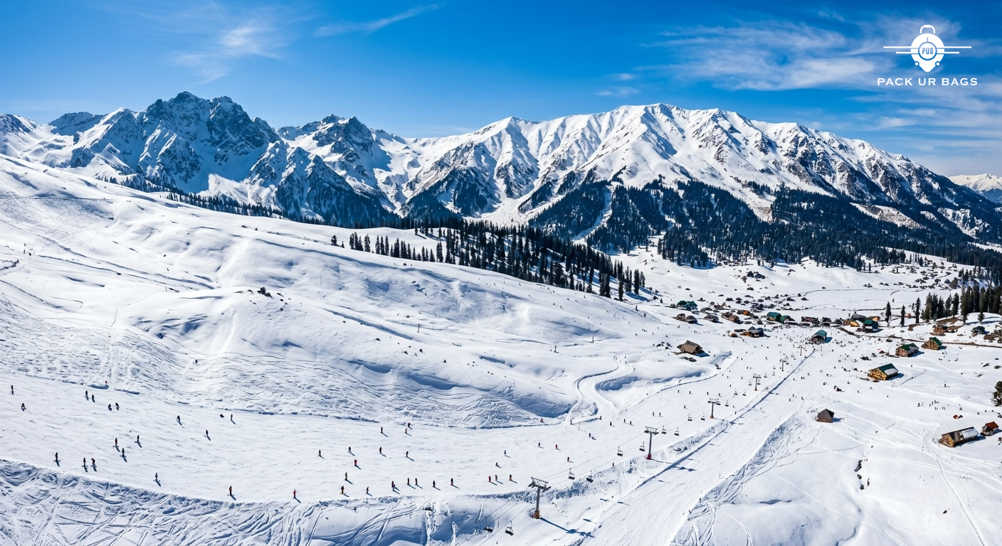 Aerial view of Gulmarg meadows with skiers in the distance, pristine snow, bright blue sky, sense of scale and alpine be